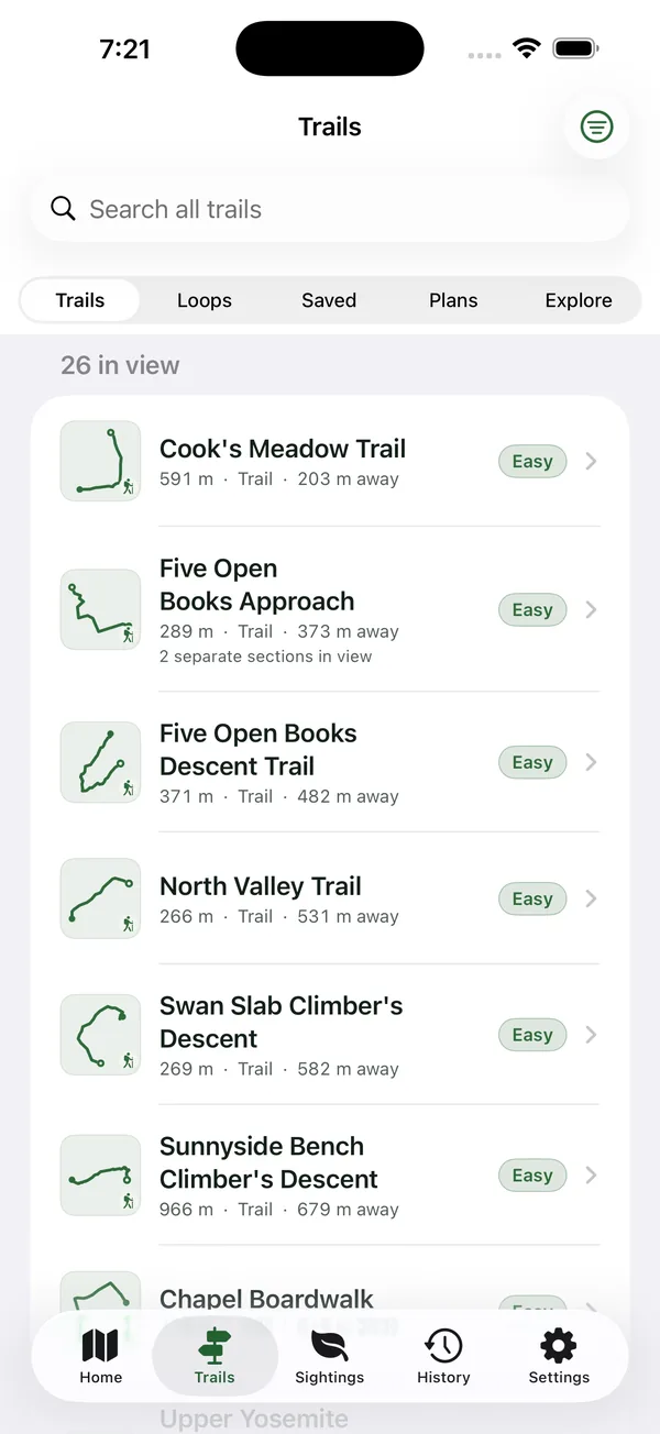 Trails list with 26 routes in view, each with length, distance away and a difficulty rating